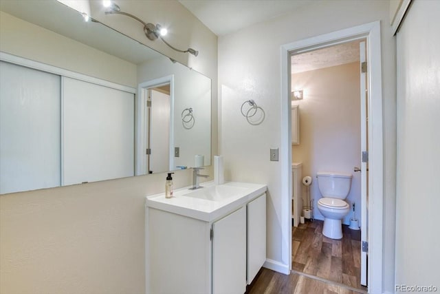6007 Yarrow St Unit D, Arvada, CO 80004 - bathroom featuring vanity and wood finished floors
