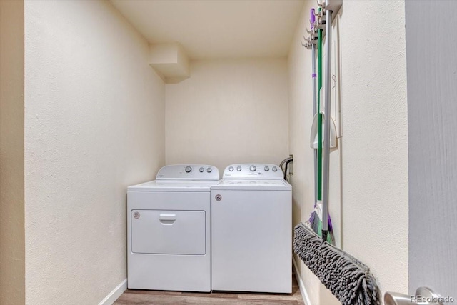 6007 Yarrow St Unit D, Arvada, CO 80004 - laundry room featuring washing machine and dryer and wood finished floors
