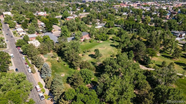 6007 Yarrow St Unit D, Arvada, CO 80004 - aerial view of property and surrounding area with a tree filled landscape