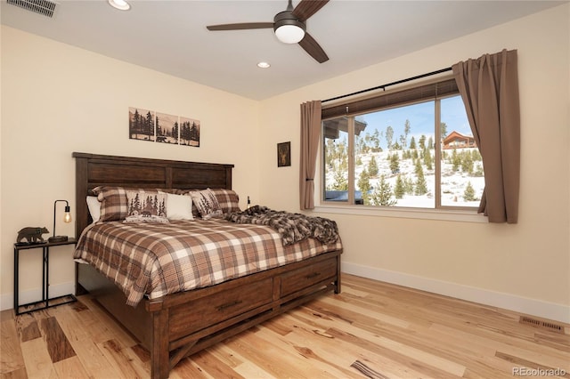 bedroom with ceiling fan and light hardwood / wood-style flooring