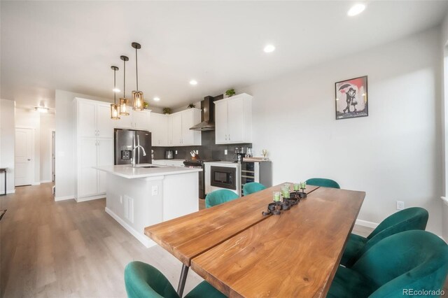 11524 Dewey St, Parker, CO 80138 - dining area with baseboards, recessed lighting, and light wood-style flooring