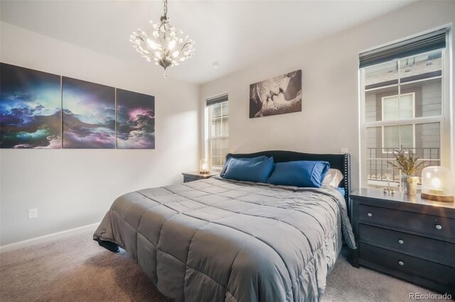11524 Dewey St, Parker, CO 80138 - bedroom featuring carpet floors, baseboards, a notable chandelier, and multiple windows