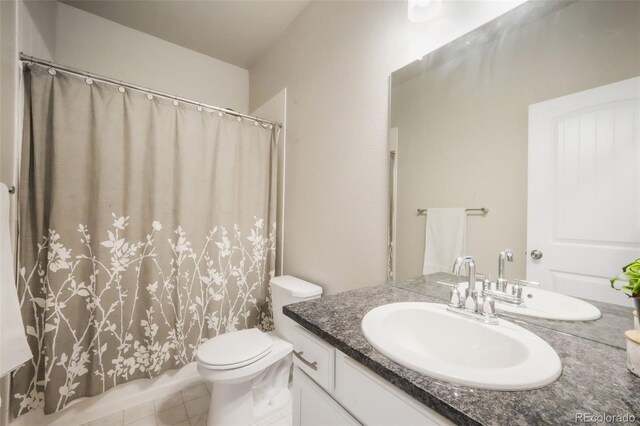 11524 Dewey St, Parker, CO 80138 - full bathroom featuring vanity, toilet, and a shower with curtain