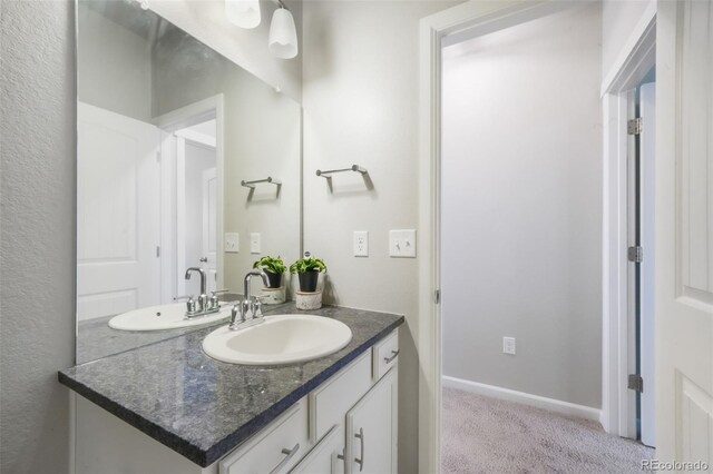 11524 Dewey St, Parker, CO 80138 - bathroom with vanity and baseboards