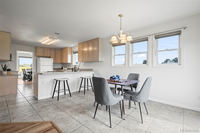 46531 Sundance Trl, Parker, CO 80138 - dining area with a chandelier and light tile patterned floors