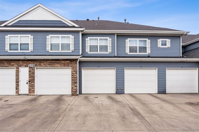 garage with concrete driveway