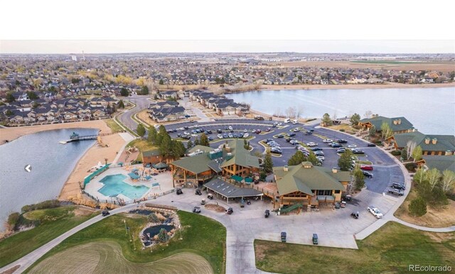 bird's eye view with a water view and a residential view