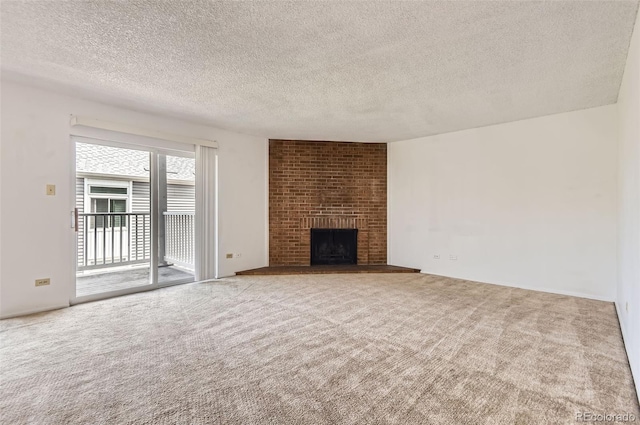 3436 S Locust St Unit D, Denver, CO 80222 - unfurnished living room with a textured ceiling, carpet, and a fireplace
