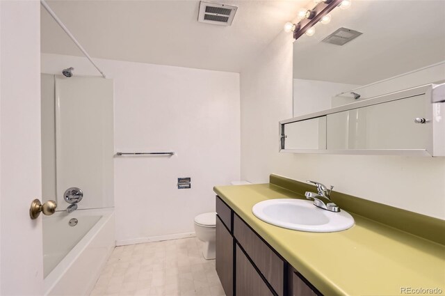 3436 S Locust St Unit D, Denver, CO 80222 - bathroom with vanity, toilet, shower / bathtub combination, tile patterned floors, and baseboards
