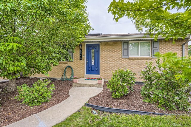 6046 Vrain St, Arvada, CO 80003 - view of front of house with brick siding