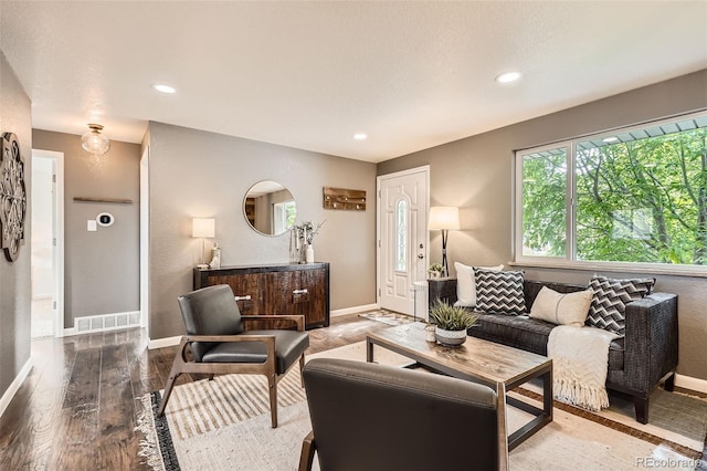 6046 Vrain St, Arvada, CO 80003 - living area featuring baseboards, wood finished floors, and recessed lighting