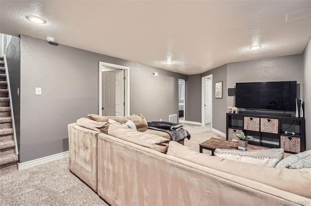 6046 Vrain St, Arvada, CO 80003 - living area featuring stairs, light carpet, baseboards, a textured wall, and recessed lighting