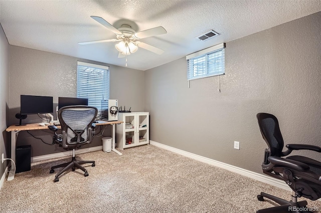 6046 Vrain St, Arvada, CO 80003 - home office featuring a textured wall, carpet flooring, ceiling fan, baseboards, and a textured ceiling