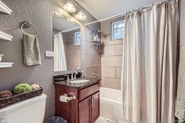 6046 Vrain St, Arvada, CO 80003 - full bath featuring toilet, vanity, shower / bath combo with shower curtain, a textured ceiling, and a textured wall