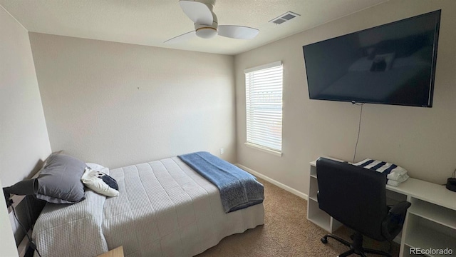 bedroom with carpet, visible vents, ceiling fan, and baseboards