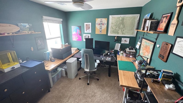 office area with ceiling fan and carpet