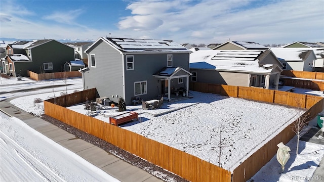 exterior space with a patio, a fenced backyard, and a residential view