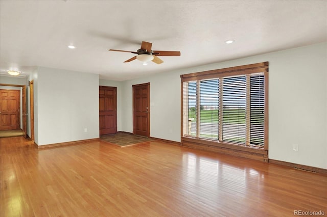 unfurnished living room featuring light wood finished floors, ceiling fan, baseboards, and recessed lighting
