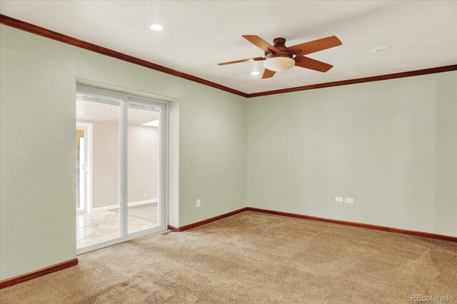empty room featuring carpet flooring, ornamental molding, a ceiling fan, recessed lighting, and baseboards