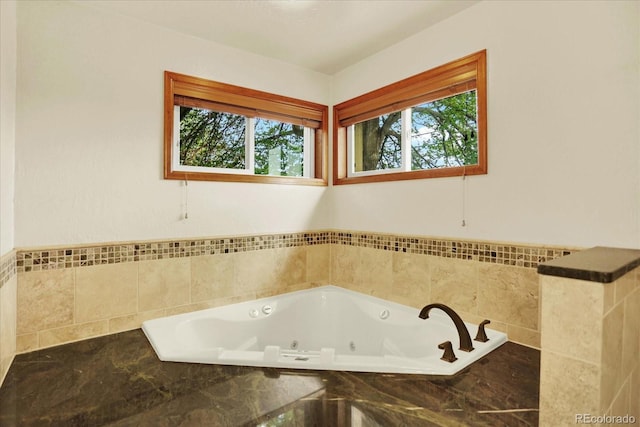bathroom with a jetted tub