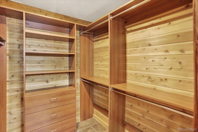 walk in closet featuring light tile patterned floors