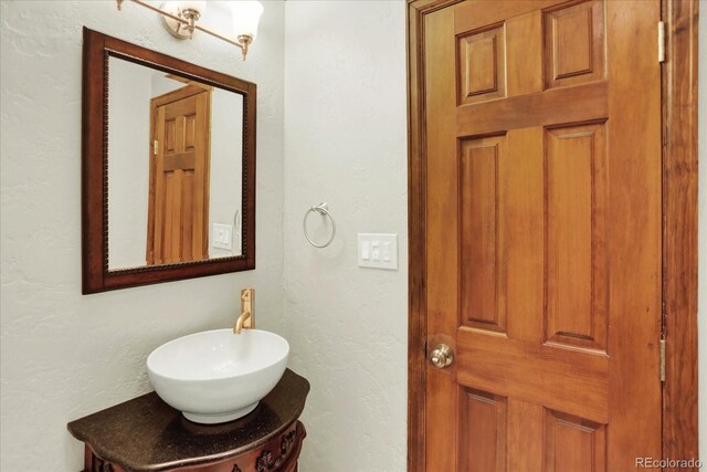 bathroom with a sink and a textured wall
