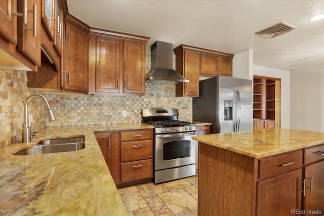 7895 W 67th Ave, Arvada, CO 80004 - kitchen featuring wall chimney exhaust hood, appliances with stainless steel finishes, a sink, light stone countertops, and tasteful backsplash