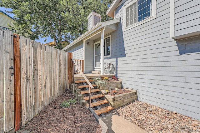10440 W 83rd Ave, Arvada, CO 80005 - property entrance featuring fence and a chimney