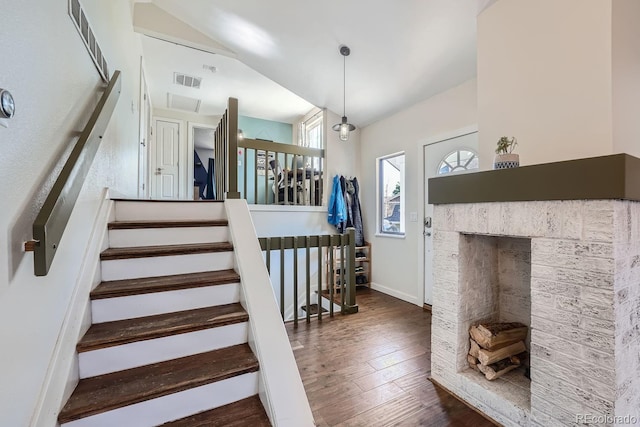 10440 W 83rd Ave, Arvada, CO 80005 - staircase featuring baseboards, wood finished floors, and visible vents