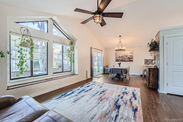 10440 W 83rd Ave, Arvada, CO 80005 - living area featuring plenty of natural light, dark wood-style flooring, ceiling fan with notable chandelier, and baseboards