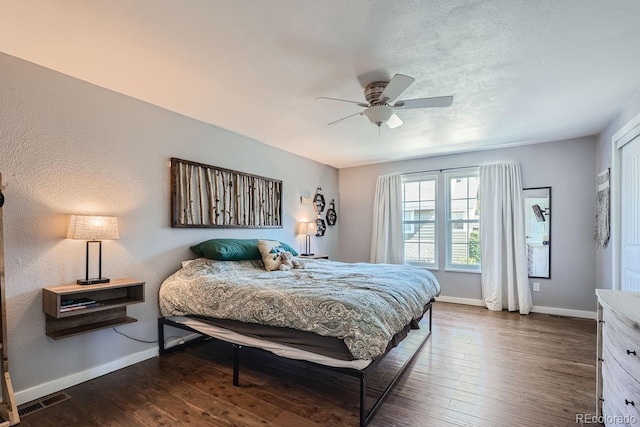 10440 W 83rd Ave, Arvada, CO 80005 - bedroom with baseboards, a ceiling fan, dark wood-type flooring, and visible vents