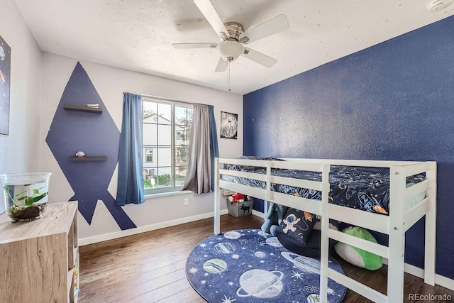 10440 W 83rd Ave, Arvada, CO 80005 - bedroom with baseboards, a ceiling fan, and wood finished floors