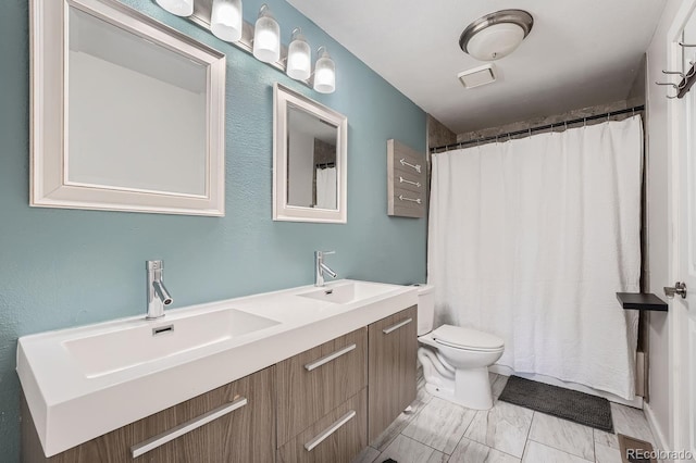 10440 W 83rd Ave, Arvada, CO 80005 - full bath featuring double vanity, toilet, visible vents, and a sink
