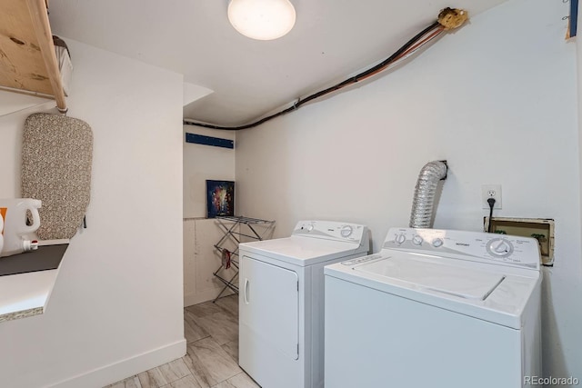 10440 W 83rd Ave, Arvada, CO 80005 - clothes washing area featuring baseboards, laundry area, and washer and dryer