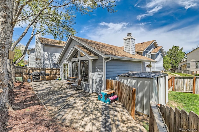 10440 W 83rd Ave, Arvada, CO 80005 - back of property with an outdoor structure, a fenced backyard, and a shed