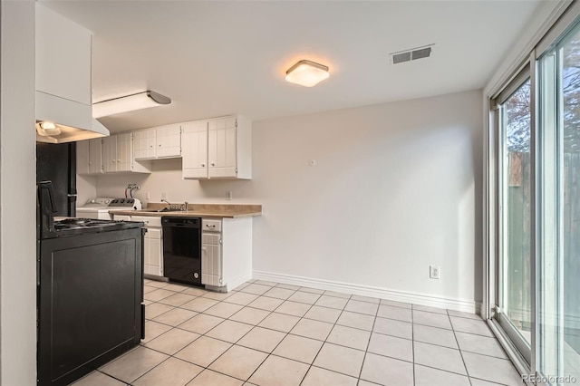 kitchen featuring white cabinetry, dishwasher, washer / dryer, and light tile patterned floors