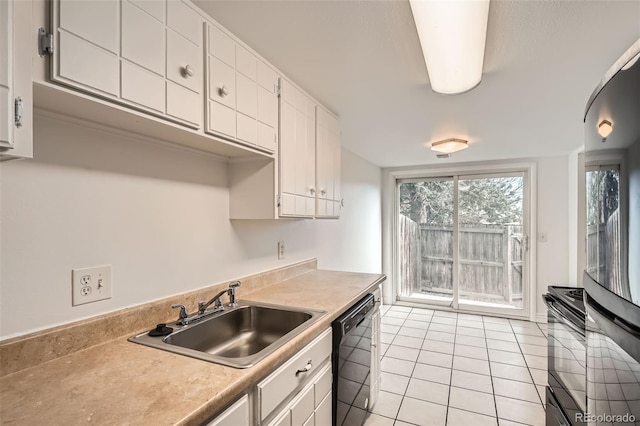 kitchen with sink, white cabinetry, range, light tile patterned floors, and black dishwasher