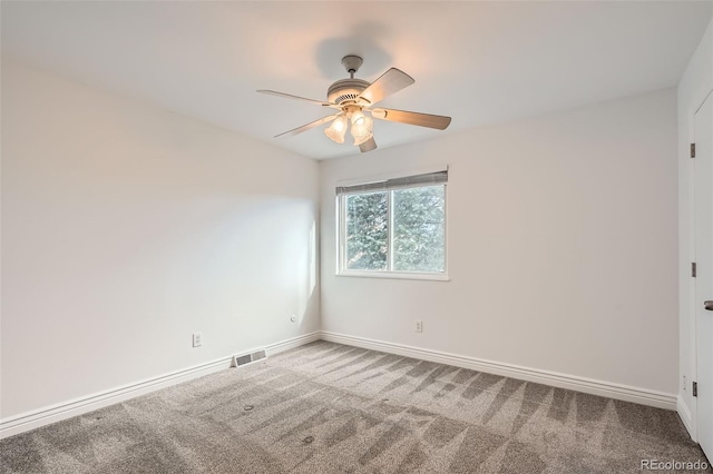 carpeted empty room with ceiling fan