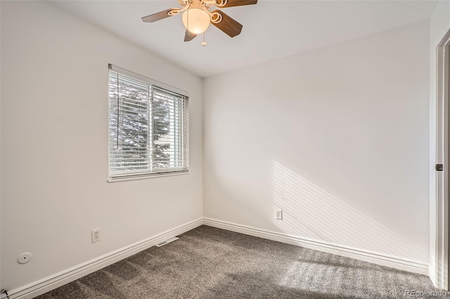 spare room featuring carpet floors and ceiling fan