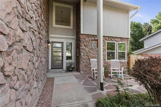 7951 S Webster Way, Littleton, CO 80128 - doorway to property with stone siding