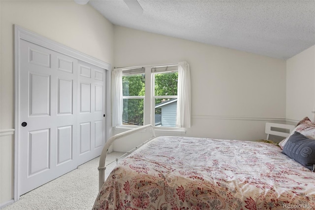 7951 S Webster Way, Littleton, CO 80128 - bedroom with carpet floors, lofted ceiling, a textured ceiling, ceiling fan, and a closet