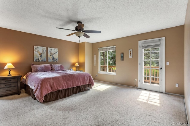 7951 S Webster Way, Littleton, CO 80128 - bedroom with access to exterior, carpet floors, a textured ceiling, and a ceiling fan
