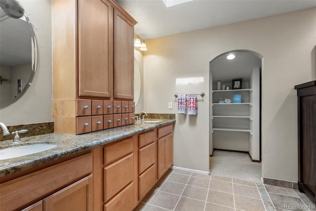 7951 S Webster Way, Littleton, CO 80128 - full bath featuring double vanity and tile patterned floors