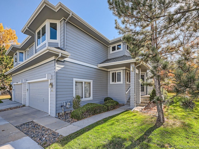 view of property exterior with a garage and a lawn