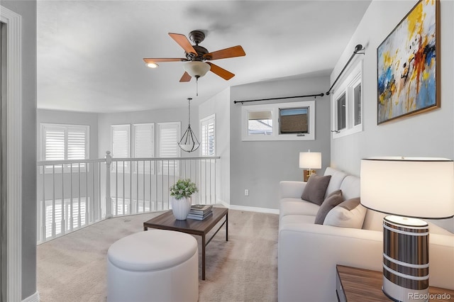 carpeted living room featuring ceiling fan