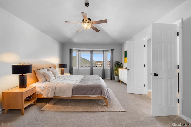 carpeted bedroom with lofted ceiling and ceiling fan