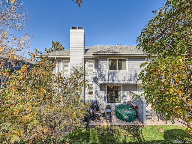 back of property featuring a patio area