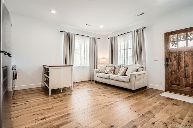 6102 S Aberdeen St, Littleton, CO 80120 - living area featuring light wood-style floors, baseboards, and recessed lighting