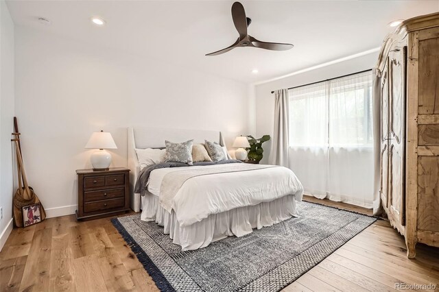 6102 S Aberdeen St, Littleton, CO 80120 - bedroom with light wood finished floors, recessed lighting, ceiling fan, and baseboards
