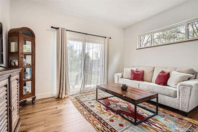 6102 S Aberdeen St, Littleton, CO 80120 - living area featuring light wood-type flooring and baseboards